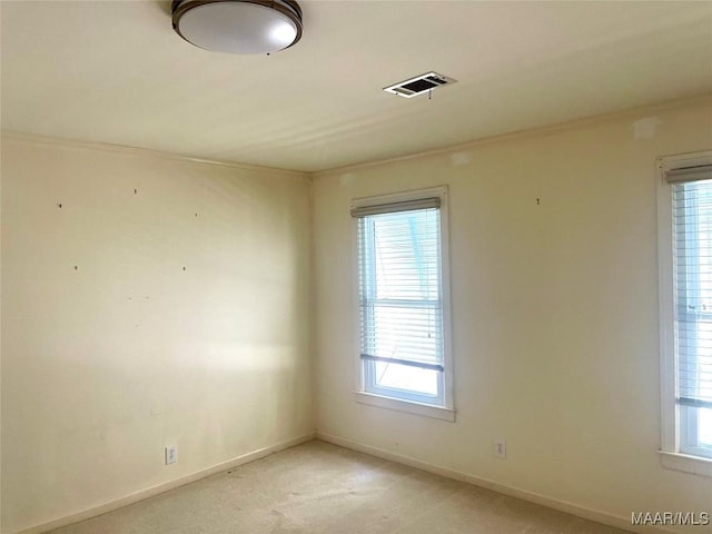 9858 Wynchase Cir, Montgomery, AL 36117 - unfurnished room featuring light carpet, healthy amount of natural light, and ornamental molding