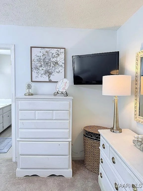 312 Rebekah Ln, Montgomery, AL 36109 - carpeted bedroom with a textured ceiling