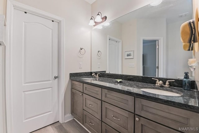 174 Shadow Wood Ln, Wetumpka, AL 36092 - full bath featuring double vanity and wood finished floors