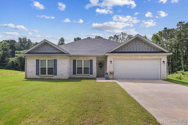 174 Shadow Wood Ln, Wetumpka, AL 36092 - view of front of house featuring an attached garage, concrete driveway, brick siding, and a front lawn