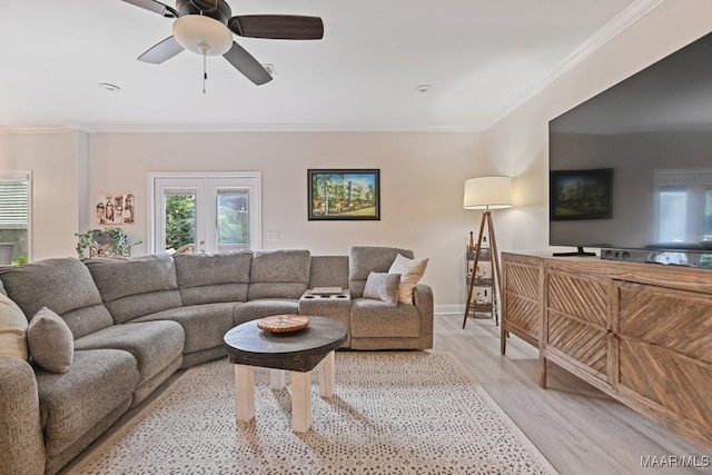 174 Shadow Wood Ln, Wetumpka, AL 36092 - living room featuring ornamental molding, light wood-style flooring, and a ceiling fan