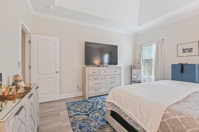 174 Shadow Wood Ln, Wetumpka, AL 36092 - bedroom featuring light wood-type flooring, a tray ceiling, and ornamental molding