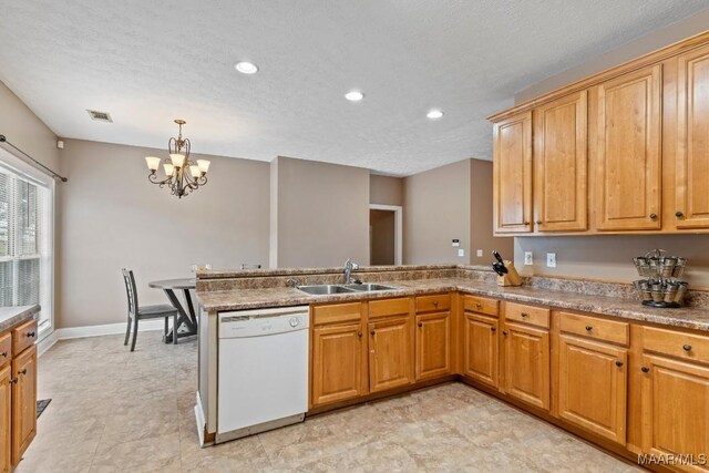 1018 Austin St, Wetumpka, AL 36092 - kitchen with white dishwasher, a peninsula, a chandelier, recessed lighting, and a textured ceiling