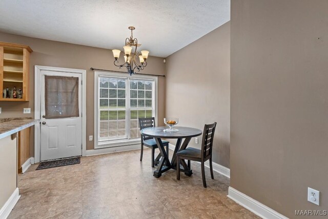 1018 Austin St, Wetumpka, AL 36092 - dining area with a chandelier and bar