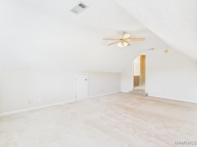 7467 Old Pump Rd, Montgomery, AL 36117 - additional living space featuring vaulted ceiling, light carpet, and a ceiling fan