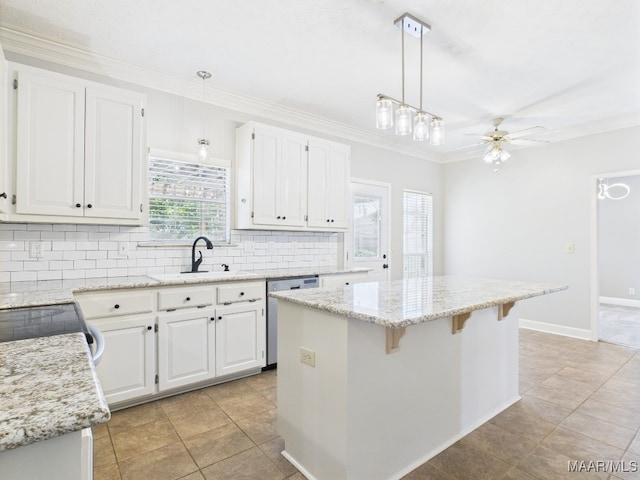 7467 Old Pump Rd, Montgomery, AL 36117 - kitchen featuring stainless steel dishwasher, white cabinetry, decorative backsplash, a kitchen island, and crown molding