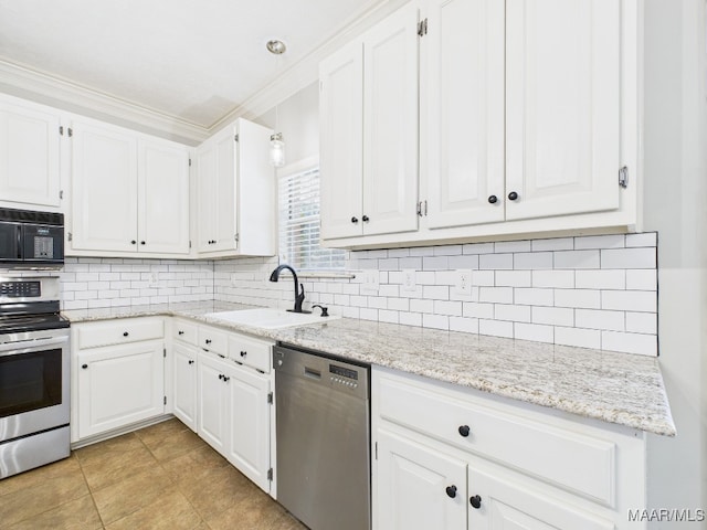 7467 Old Pump Rd, Montgomery, AL 36117 - kitchen featuring stainless steel appliances, white cabinetry, tasteful backsplash, and crown molding