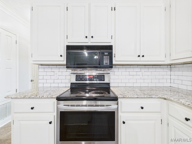 7467 Old Pump Rd, Montgomery, AL 36117 - kitchen with stainless steel range with electric cooktop, black microwave, white cabinetry, tasteful backsplash, and crown molding