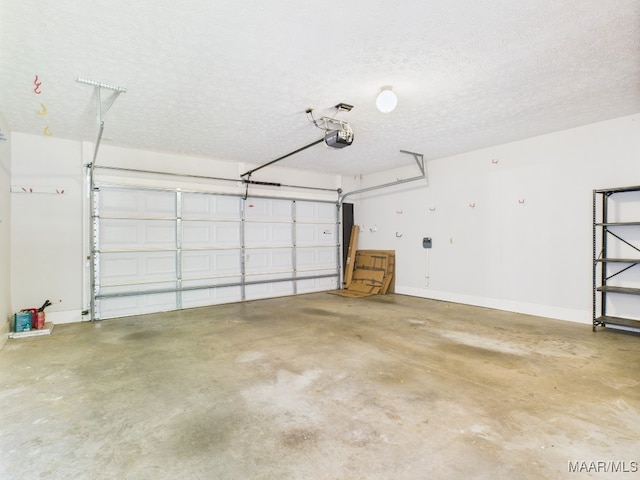 7467 Old Pump Rd, Montgomery, AL 36117 - garage with a garage door opener and baseboards