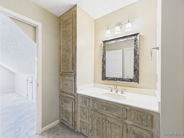 7467 Old Pump Rd, Montgomery, AL 36117 - bathroom with vanity and a textured ceiling