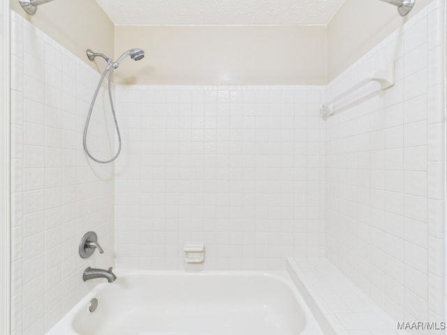 7467 Old Pump Rd, Montgomery, AL 36117 - bathroom with bathing tub / shower combination and a textured ceiling