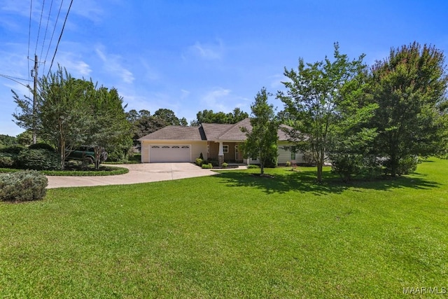 2196 N Ann Ave, Tallassee, AL 36078 - view of front of property with an attached garage, concrete driveway, and a front lawn