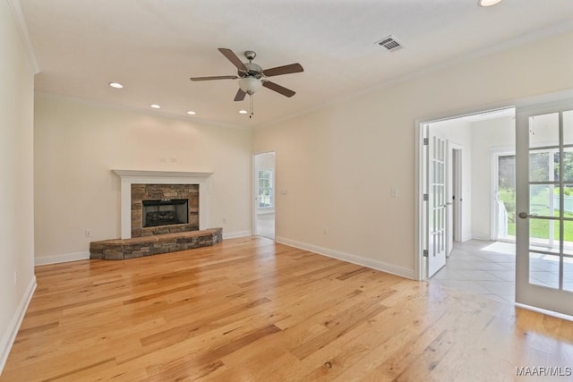 2196 N Ann Ave, Tallassee, AL 36078 - unfurnished living room featuring light wood-style flooring, ceiling fan, recessed lighting, crown molding, and a fireplace
