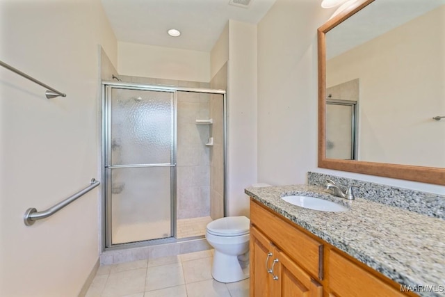 2196 N Ann Ave, Tallassee, AL 36078 - bathroom featuring vanity, tile patterned floors, and a stall shower