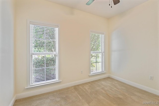 2196 N Ann Ave, Tallassee, AL 36078 - empty room featuring plenty of natural light, ceiling fan, and light colored carpet