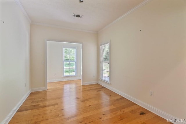2196 N Ann Ave, Tallassee, AL 36078 - unfurnished room with light wood-style flooring and ornamental molding