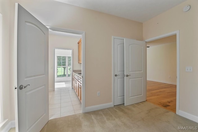 2196 N Ann Ave, Tallassee, AL 36078 - unfurnished bedroom featuring baseboards and light carpet