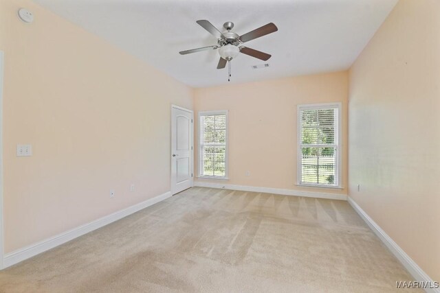 2196 N Ann Ave, Tallassee, AL 36078 - unfurnished room featuring light colored carpet, a ceiling fan, and a smoke detector