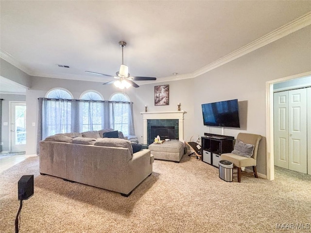 7908 Arrowhead Forest Ct, Montgomery, AL 36117 - living area featuring carpet, crown molding, a ceiling fan, and a tiled fireplace