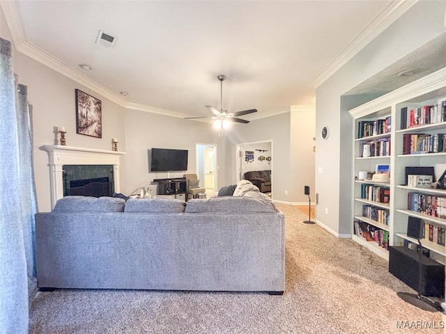 7908 Arrowhead Forest Ct, Montgomery, AL 36117 - living room featuring light colored carpet, ornamental molding, ceiling fan, a fireplace, and built in features