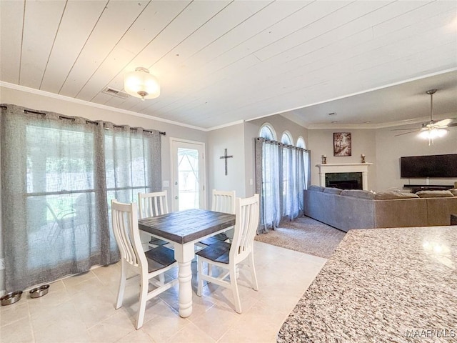 7908 Arrowhead Forest Ct, Montgomery, AL 36117 - dining space featuring ceiling fan, light tile patterned flooring, ornamental molding, a fireplace, and wooden ceiling