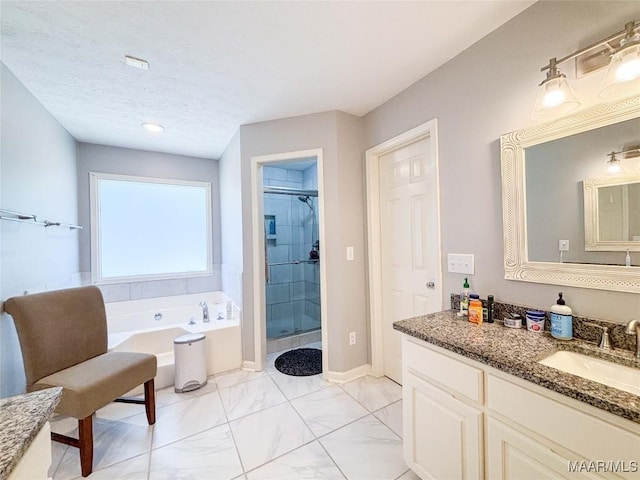 7908 Arrowhead Forest Ct, Montgomery, AL 36117 - full bathroom with a stall shower, vanity, a bath, and marble finish floors