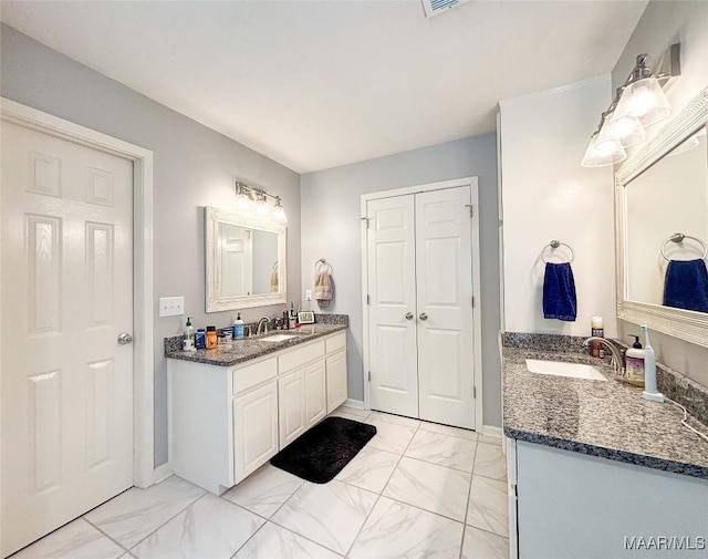 7908 Arrowhead Forest Ct, Montgomery, AL 36117 - bathroom with marble look tile flooring and two vanities