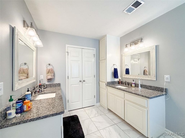 7908 Arrowhead Forest Ct, Montgomery, AL 36117 - bathroom with marble finish flooring and two vanities
