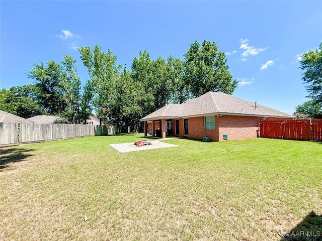7908 Arrowhead Forest Ct, Montgomery, AL 36117 - fenced backyard featuring a fire pit and a patio area