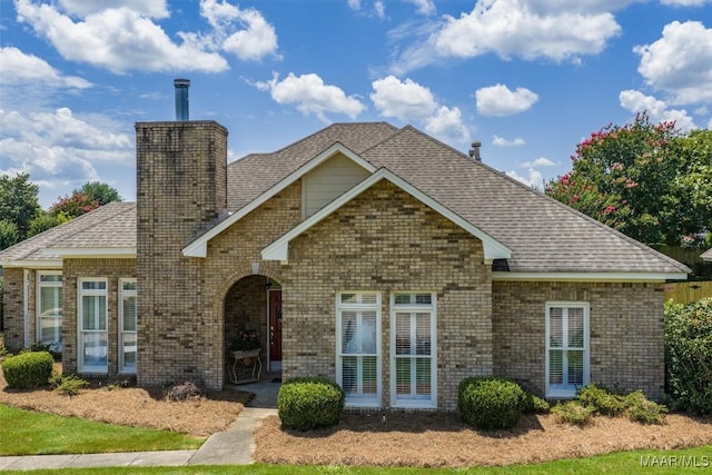 8872 Old Magnolia Way, Montgomery, AL 36116 - view of front of house featuring brick siding, a chimney, and a shingled roof