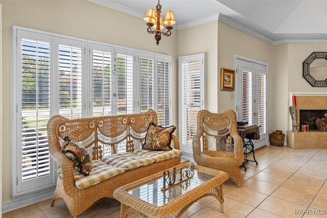 8872 Old Magnolia Way, Montgomery, AL 36116 - living area with tile patterned floors, crown molding, a chandelier, and a tiled fireplace