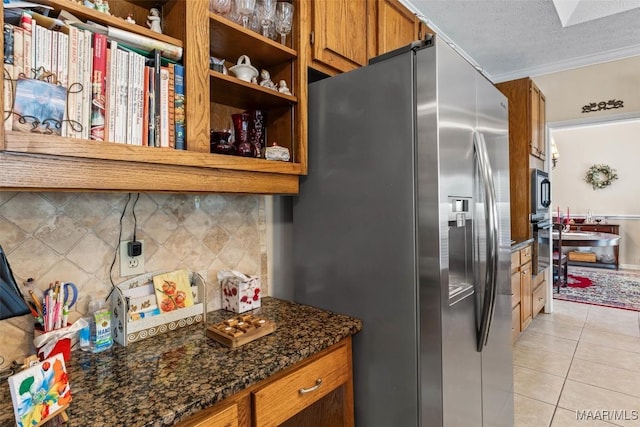 8872 Old Magnolia Way, Montgomery, AL 36116 - kitchen with stainless steel refrigerator with ice dispenser, open shelves, light tile patterned floors, brown cabinetry, and backsplash