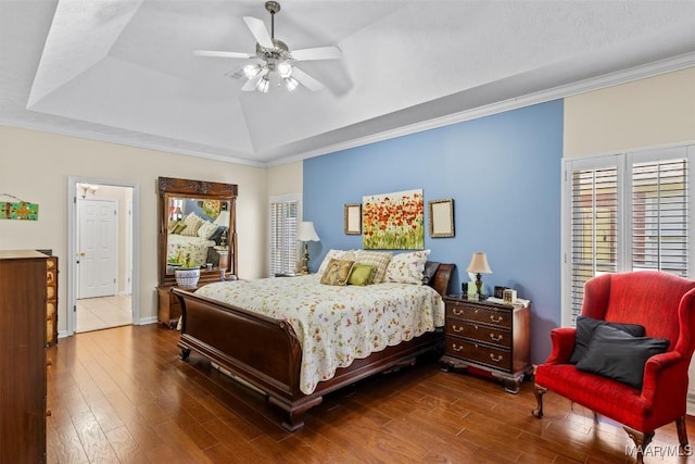 8872 Old Magnolia Way, Montgomery, AL 36116 - bedroom with a tray ceiling, dark wood-style flooring, ornamental molding, and a ceiling fan