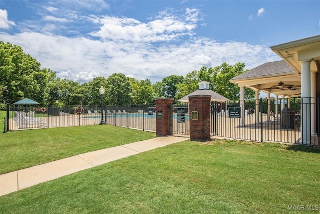 8872 Old Magnolia Way, Montgomery, AL 36116 - view of yard with a community pool, ceiling fan, and a gate