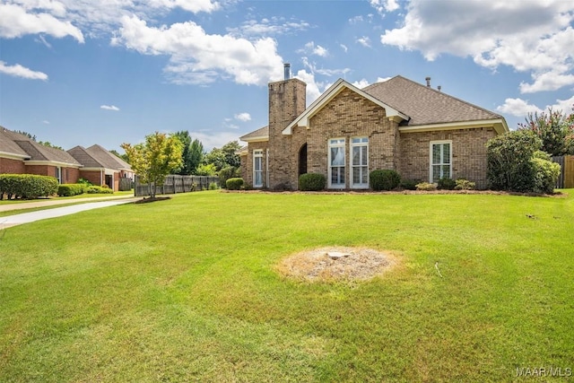 8872 Old Magnolia Way, Montgomery, AL 36116 - view of front of home with brick siding, a chimney, roof with shingles, and french doors