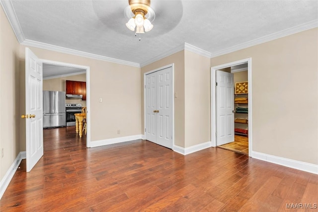 54 Pine Dr, Eclectic, AL 36024 - empty room featuring a ceiling fan, wood finished floors, ornamental molding, and a textured ceiling