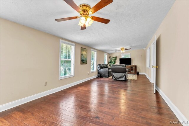 54 Pine Dr, Eclectic, AL 36024 - living area with a ceiling fan, a textured ceiling, and dark wood-type flooring