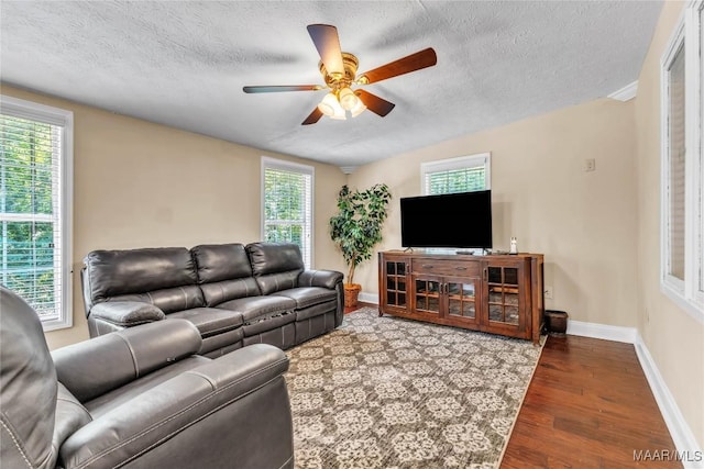 54 Pine Dr, Eclectic, AL 36024 - living area featuring ceiling fan, wood finished floors, and a textured ceiling