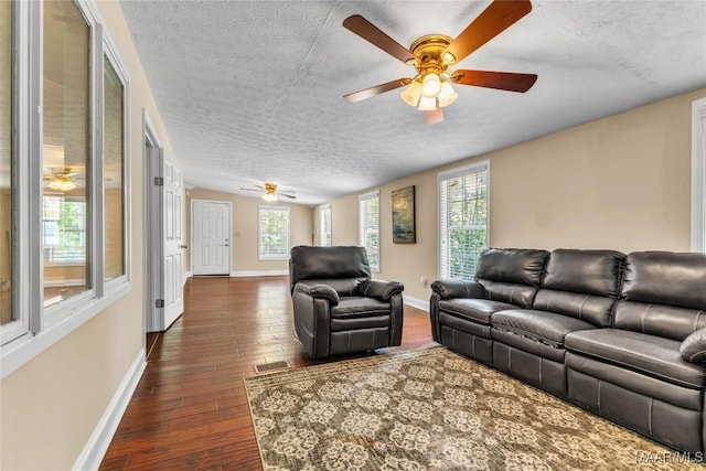 54 Pine Dr, Eclectic, AL 36024 - living room with ceiling fan, a textured ceiling, and dark wood finished floors