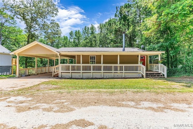 54 Pine Dr, Eclectic, AL 36024 - view of front of home with a porch, concrete driveway, and a shingled roof