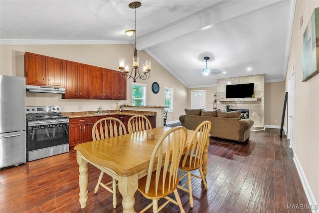54 Pine Dr, Eclectic, AL 36024 - dining space featuring dark wood finished floors, a chandelier, a large fireplace, and crown molding