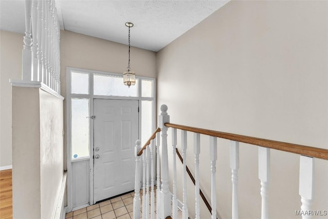 1422 Flamingo Ln, Montgomery, AL 36116 - foyer with light tile patterned flooring and a textured ceiling