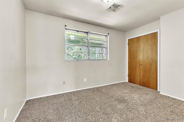 1422 Flamingo Ln, Montgomery, AL 36116 - unfurnished bedroom featuring carpet floors and a closet