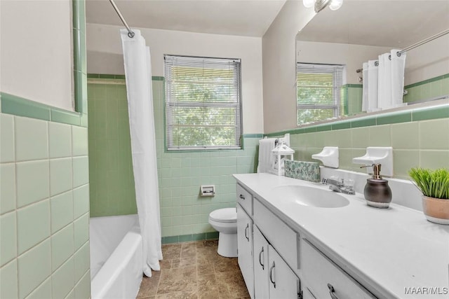 1422 Flamingo Ln, Montgomery, AL 36116 - full bathroom featuring tile walls, vanity, shower / tub combo, and wainscoting