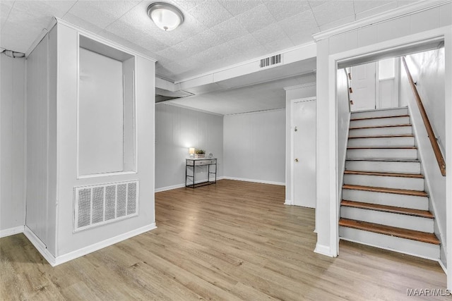 1422 Flamingo Ln, Montgomery, AL 36116 - basement with wood finished floors, stairway, and ornamental molding