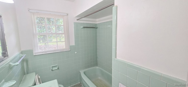 2804 Sumter Ave, Montgomery, AL 36109 - full bath featuring tile walls, wainscoting, and shower / tub combination