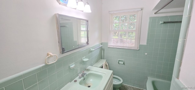 2804 Sumter Ave, Montgomery, AL 36109 - full bath featuring tile walls, a wainscoted wall, vanity, and shower / bath combination