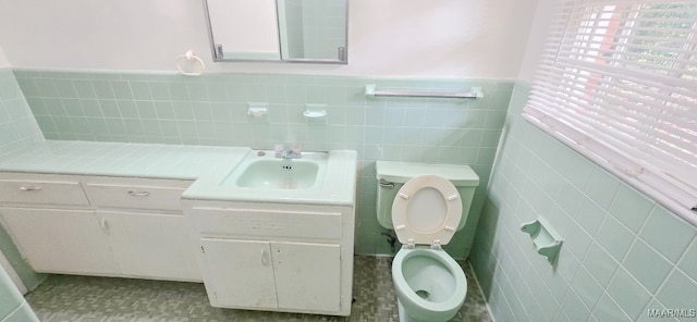 2804 Sumter Ave, Montgomery, AL 36109 - bathroom featuring vanity, a wainscoted wall, and tile walls