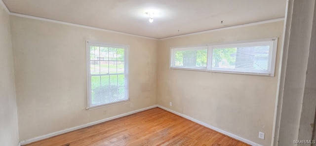 2804 Sumter Ave, Montgomery, AL 36109 - unfurnished room with ornamental molding, healthy amount of natural light, and light wood finished floors
