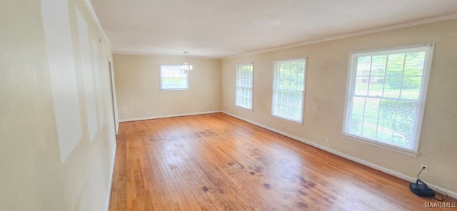 2804 Sumter Ave, Montgomery, AL 36109 - spare room with ornamental molding, wood finished floors, and a chandelier